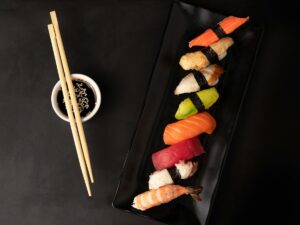 sushi on black square plate